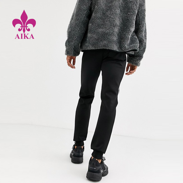 High reputation Fashion Joggers -
Custom Men Sports Running Wear Side Stripe Quick Dry Sweat Pants Skinny Joggers – AIKA detail pictures