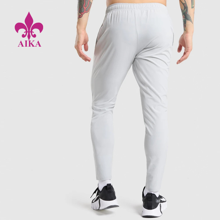 Lowest Price for Shorts For Sports Fitness -
OEM Four Way Stretch Quick Dry ligthweight Elastic Waist Nylon Track Gym Jogger Pants For Men – AIKA detail pictures