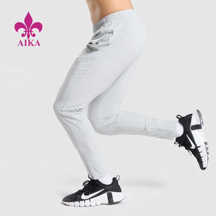 Lowest Price for Shorts For Sports Fitness -
OEM Four Way Stretch Quick Dry ligthweight Elastic Waist Nylon Track Gym Jogger Pants For Men – AIKA detail pictures