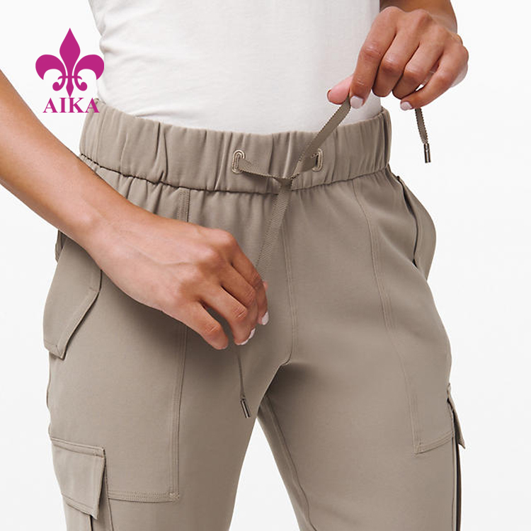 Big discounting Yoga Bra -
Custom Sports Wear Woven Medium Rise Quick Drying Cargo Pants Women Sweat Pants – AIKA detail pictures