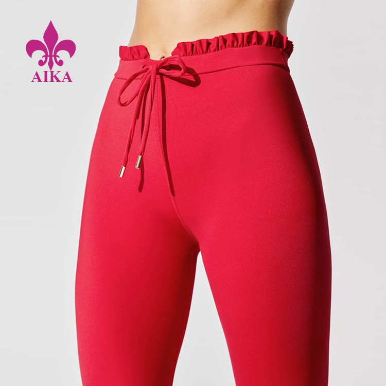 factory customized Fitness Wear Supplier -
Good price stylish and casual tights drawstring and rufflr edge yoga workout activewear leggings for women – AIKA detail pictures