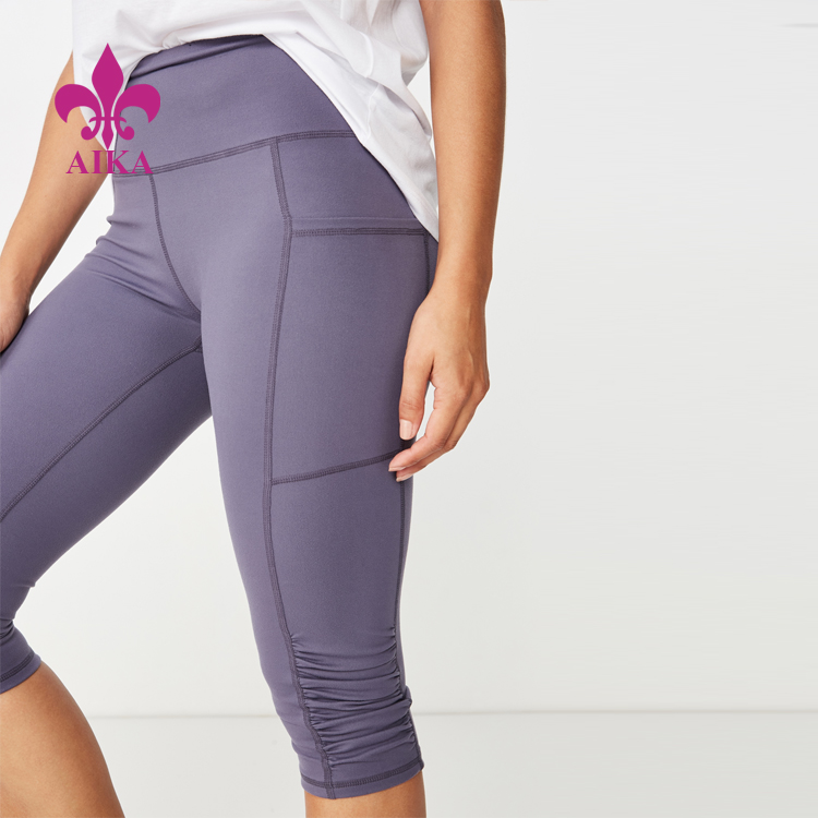Cheapest Price Fitness Apparel Manufacturer -
Ladies casual tights knee length yoga workout activewear with side pockets leggings for women – AIKA detail pictures