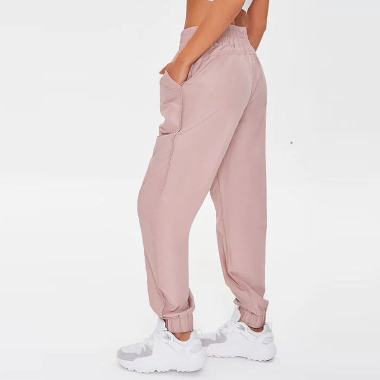 Wholesale Elastic Waist 100%Polyester Athletic Track Pants Side Pockets Gym Joggers For Women detail pictures