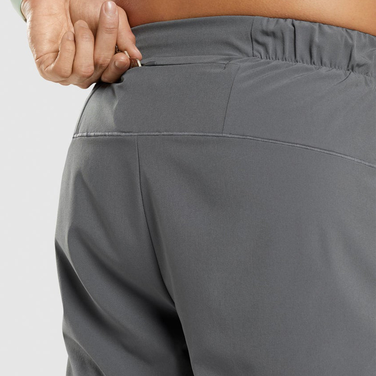 Quick Dry Polyester Sports Pants Waist Pocket Custom Slim Fit Jogger Pants For Men detail pictures