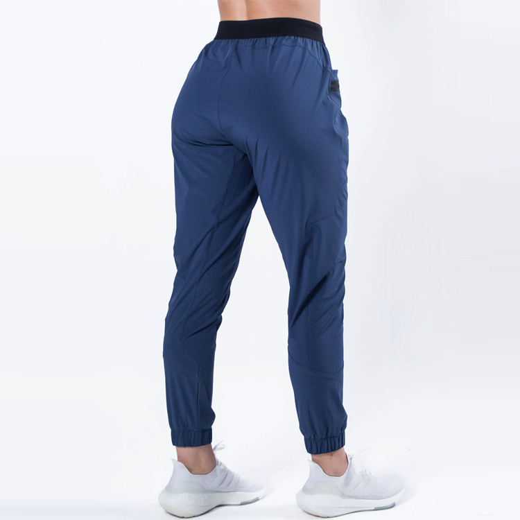 Custom Nylon Track Pants Women Training Gym Windbreaker Joggers With Reflective Strip detail pictures